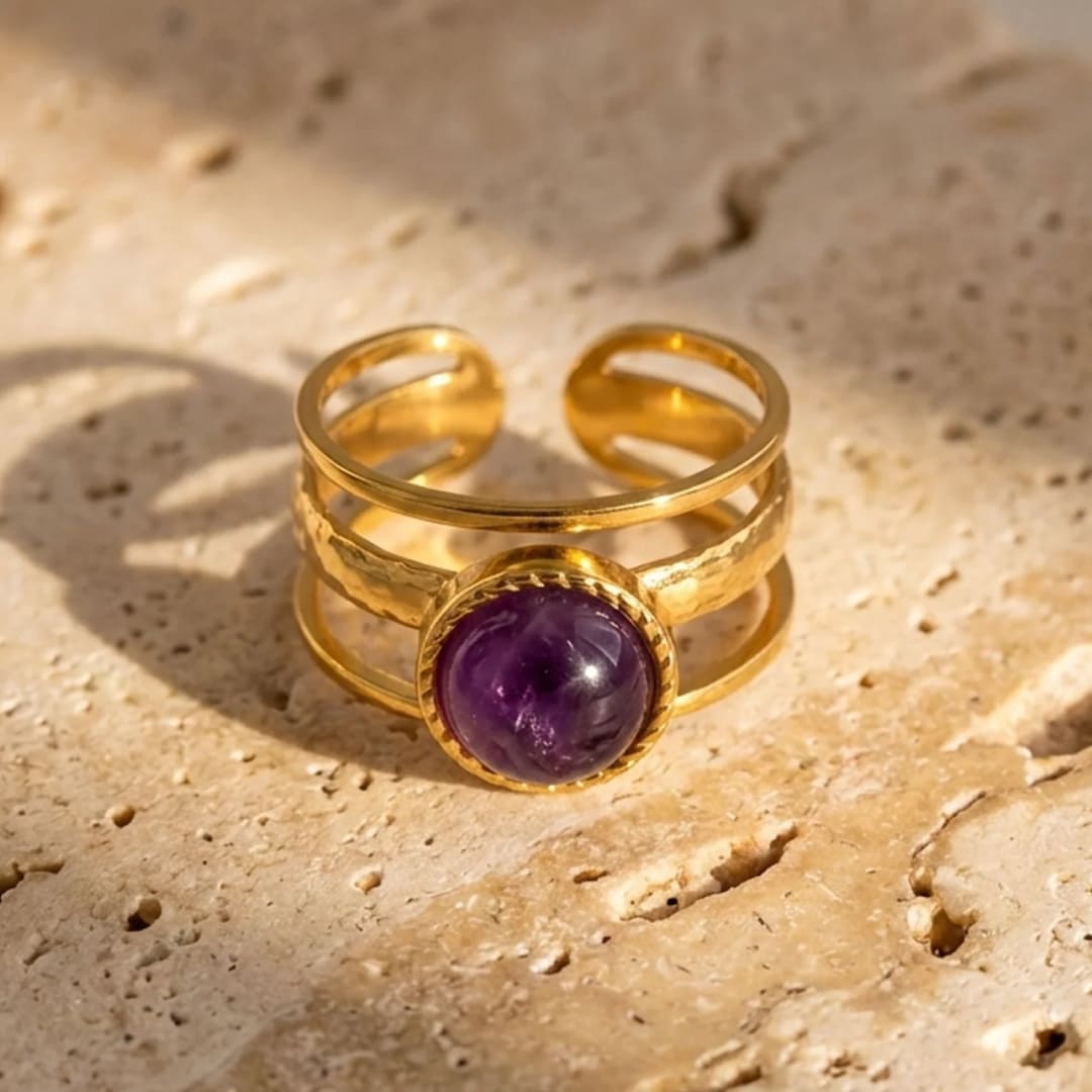 Amethyst Essence Ring with deep purple stone and golden bands