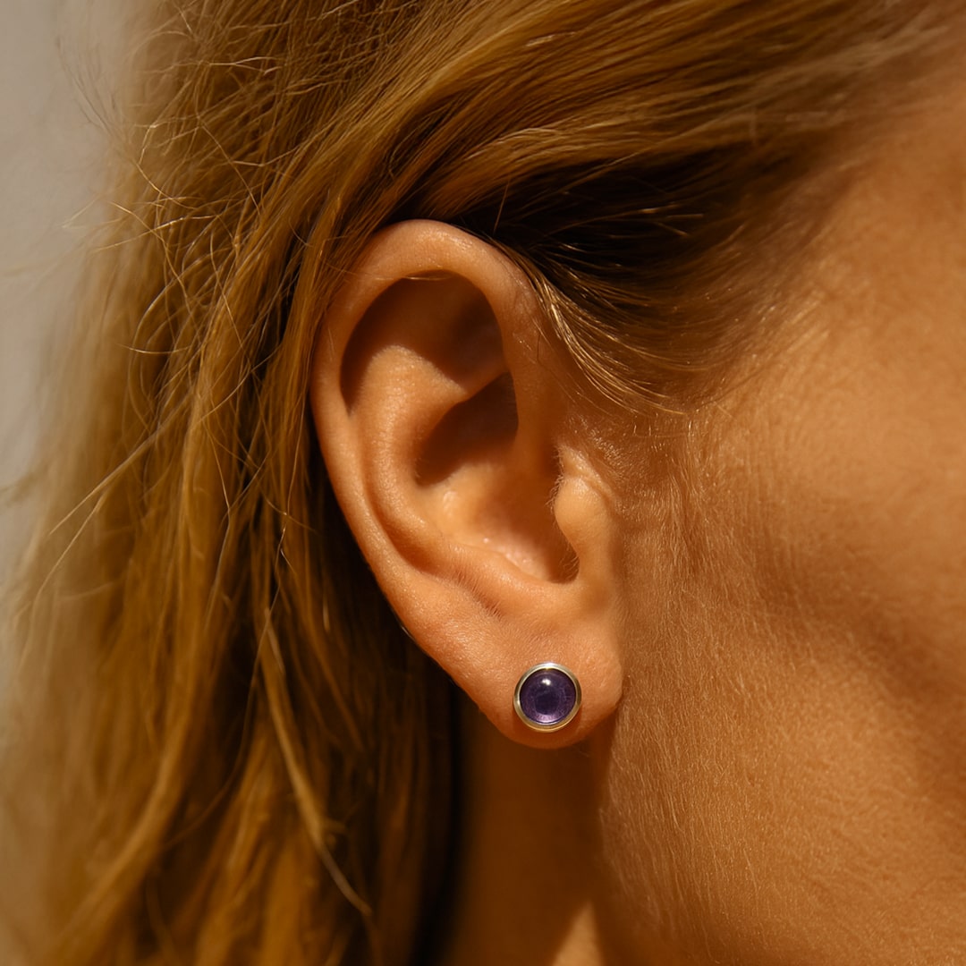 Close-up of the amethyst stone in the silver stud earrings