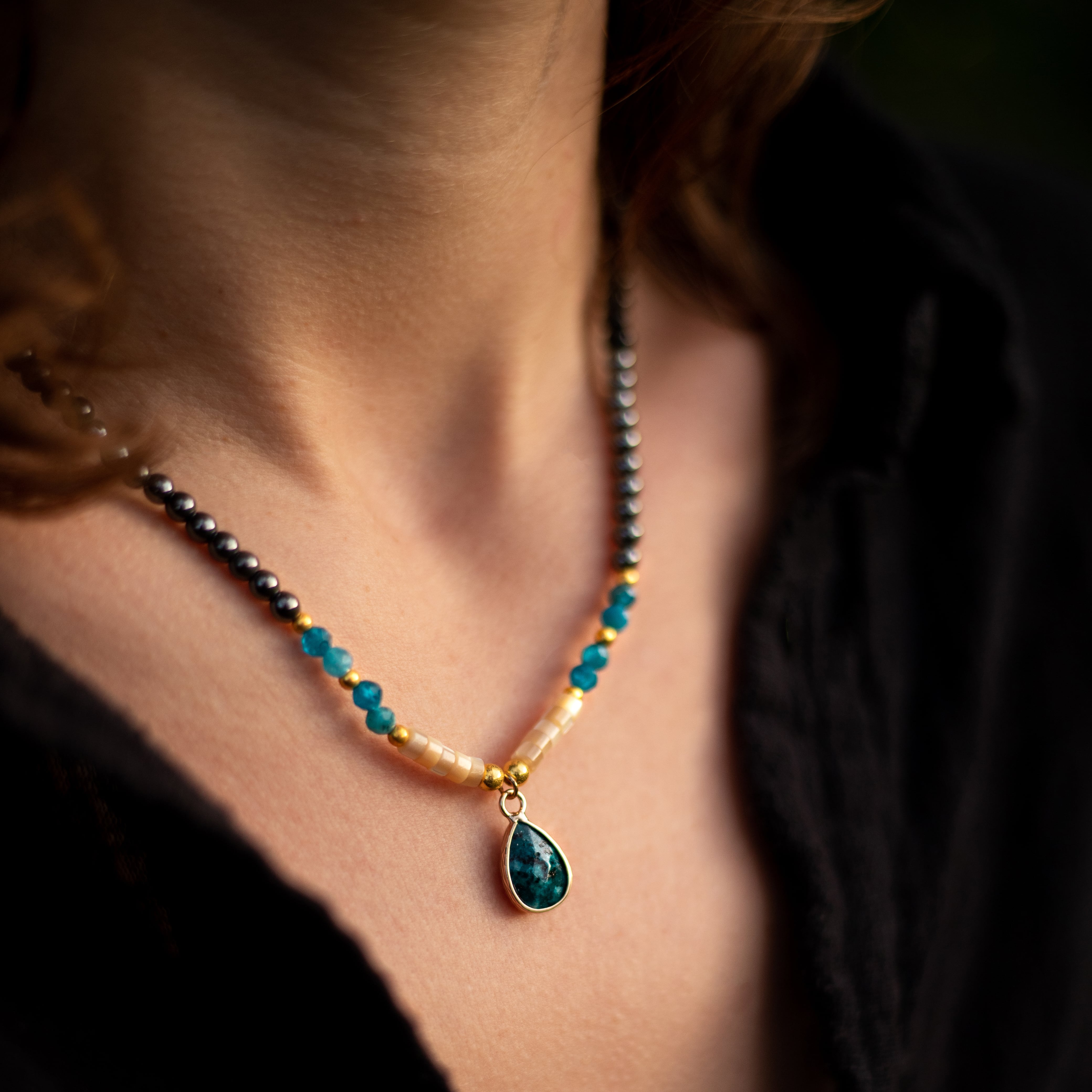Close-up of the blue Apatite drop pendant on the choker