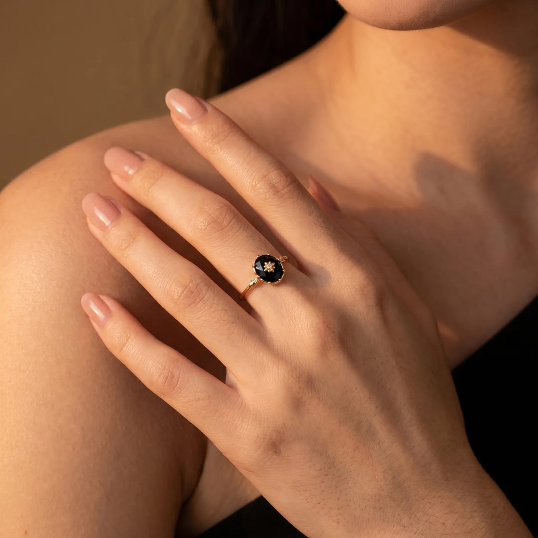 Close-up of the golden star detail on the black agate ring - KARMAKIND