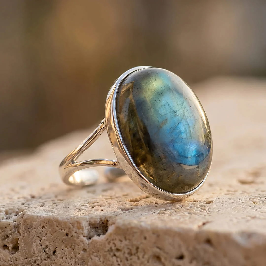 Boreal Reflections adjustable ring featuring a large Labradorite stone with iridescent flashes