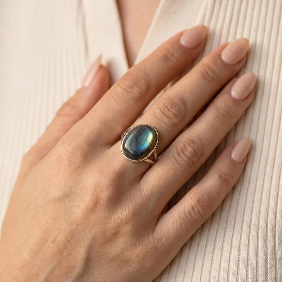 Close-up of the Labradorite stone on the ring, showing its deep color and light play