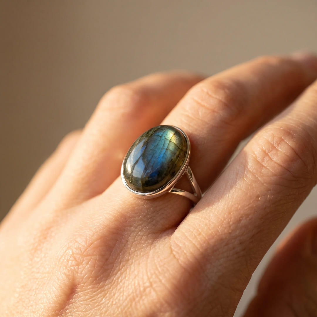 Model's hand wearing the Boreal Reflections ring, showcasing its fit