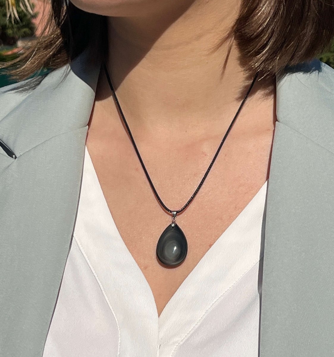 Lifestyle shot of the Celestial Eye Obsidian pendant