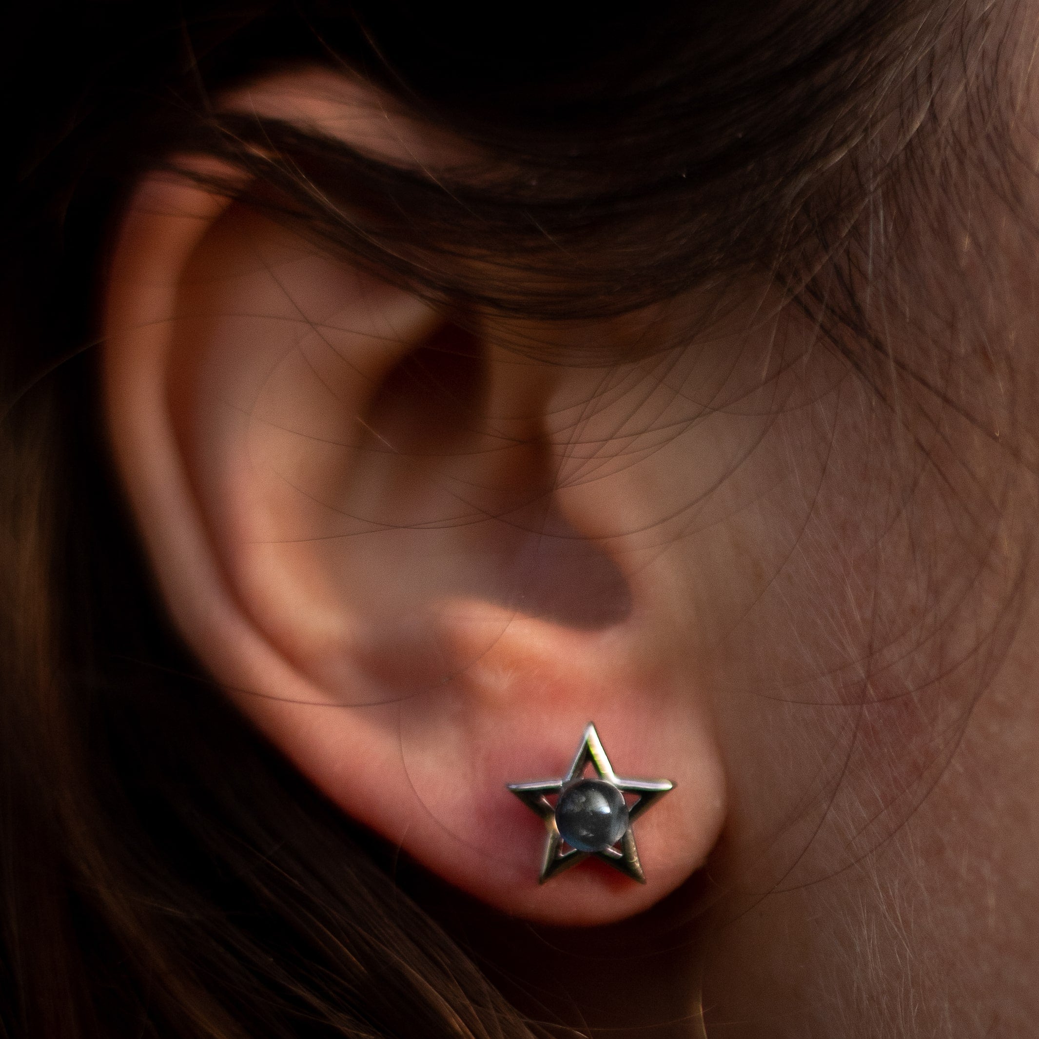 Close-up of the labradorite stone's blue flashes in the moon earring - KARMAKIND