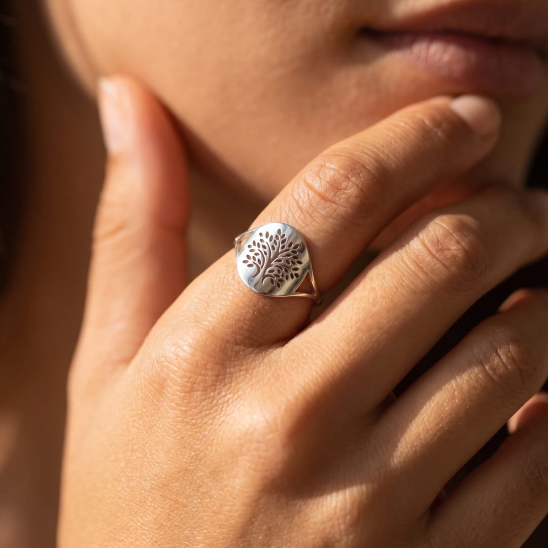 Lifestyle shot of the Chakra Tree Ring on a finger - KARMAKIND