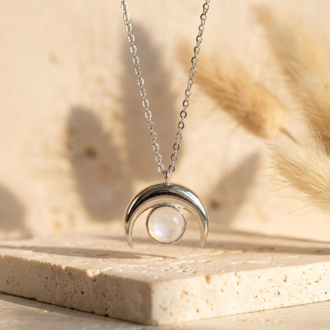 Model wearing the Crescent Moon Necklace, showing its delicate placement - KARMAKIND