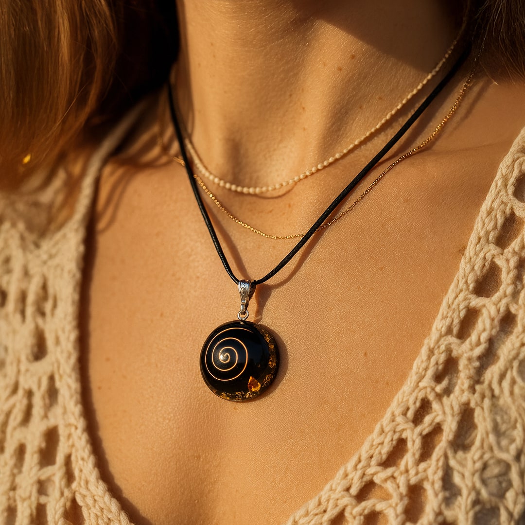 Close-up of the golden spiral on the Black Obsidian pendant - KARMAKIND