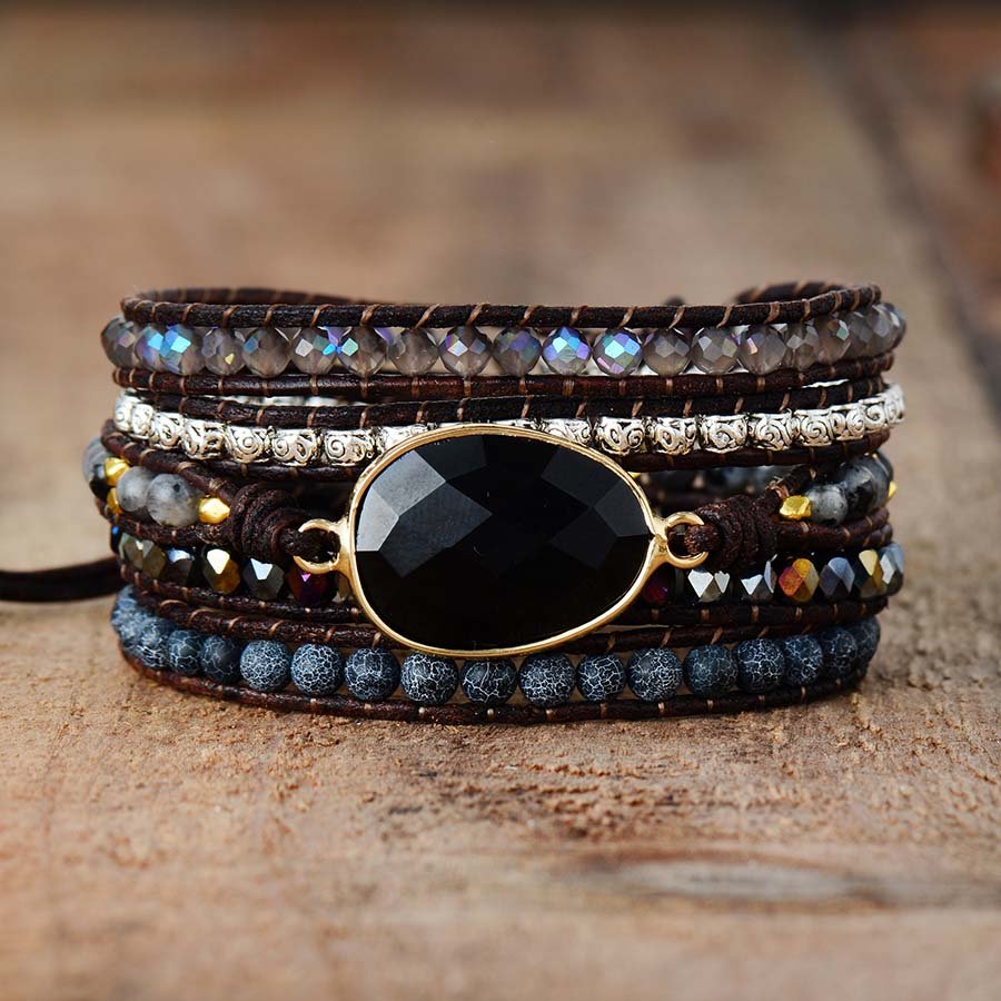Black onyx wrap bracelet with golden accents