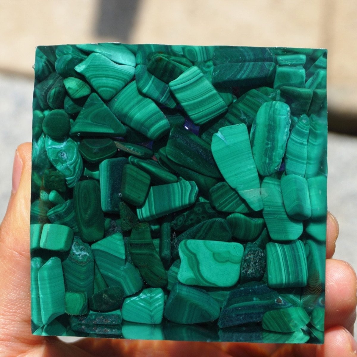 The Kâli orgonite pyramid showcasing the blend of blue, purple, and green stones - KARMAKIND
