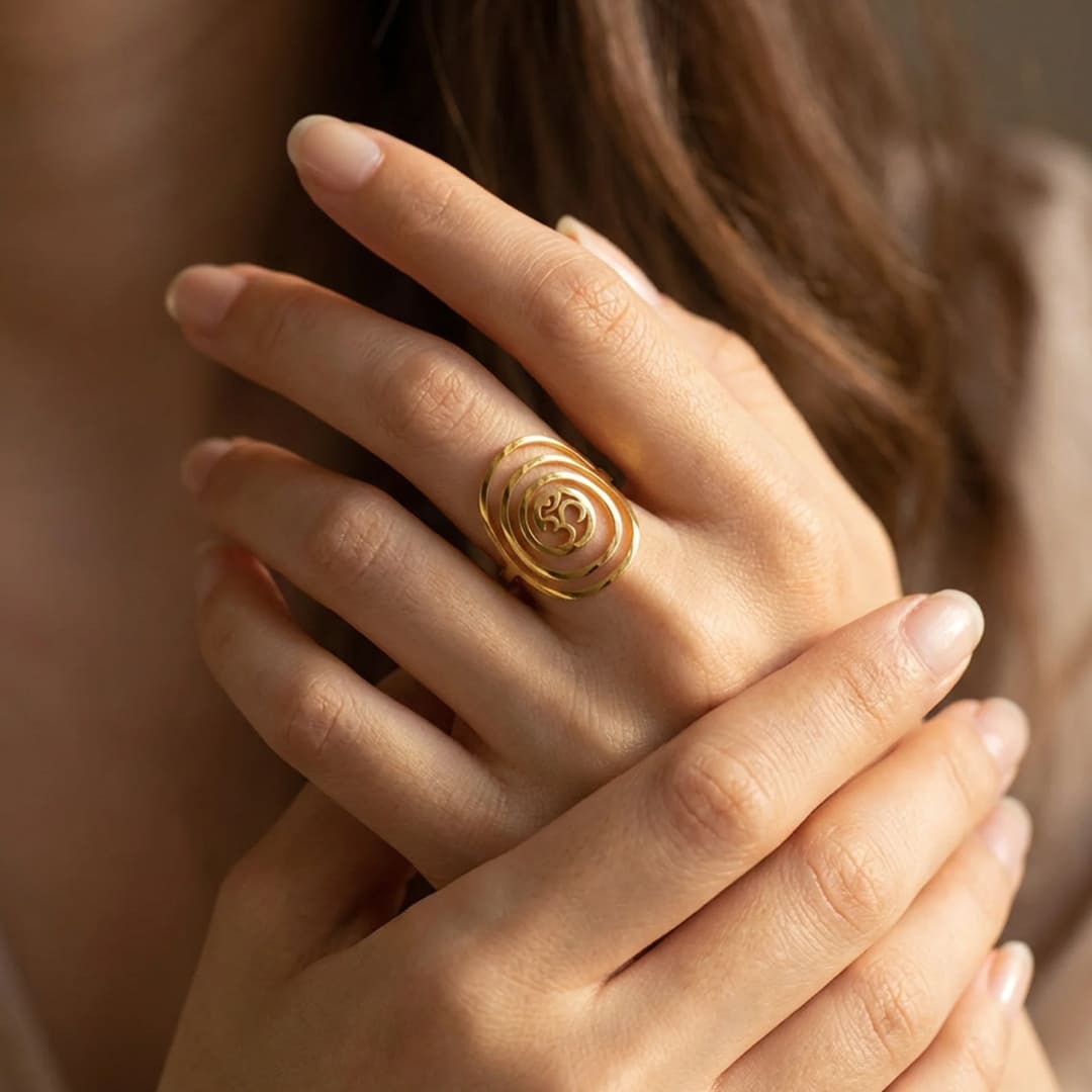 Ring with Om symbol and expanding circles - KARMAKIND