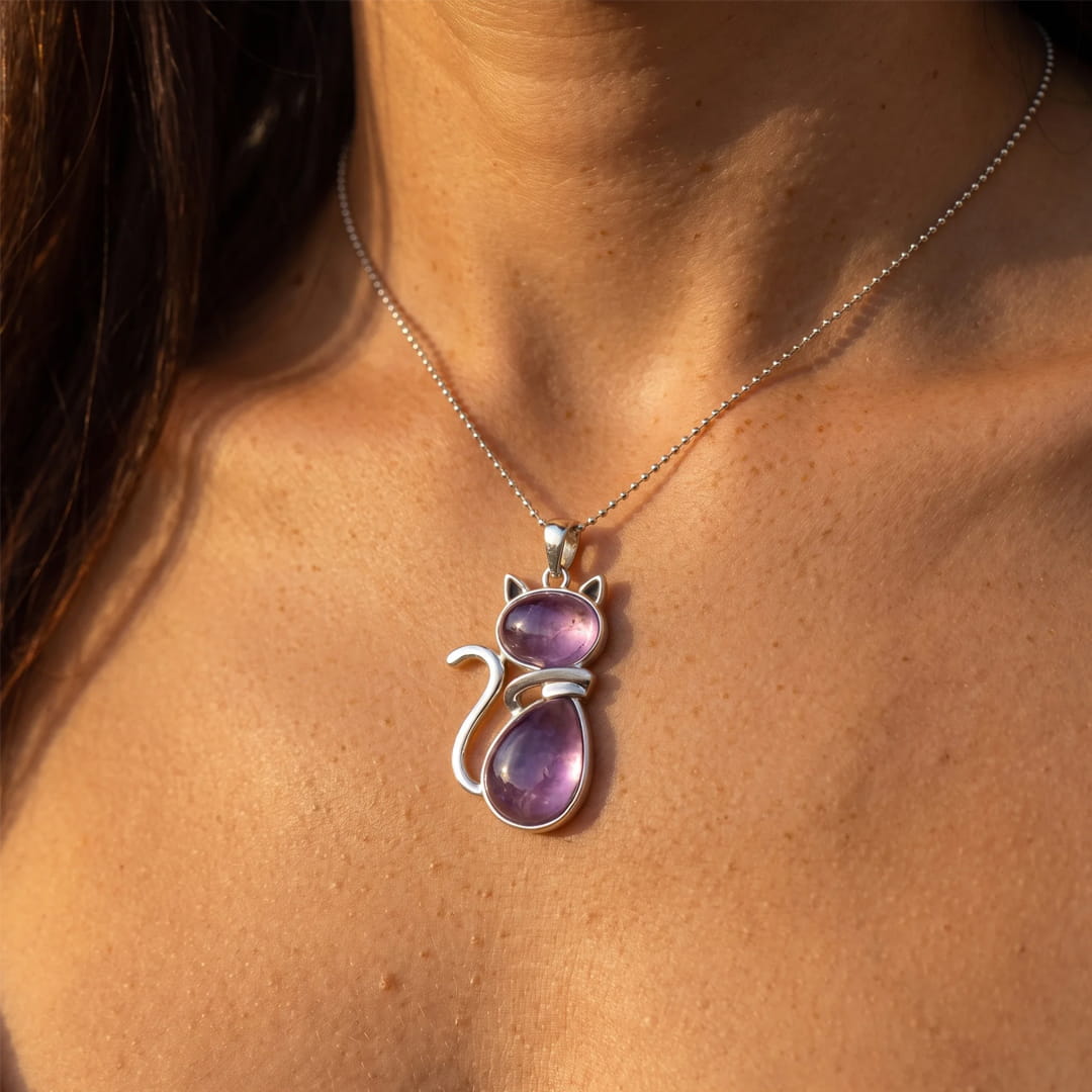 Close-up of the cat pendant showing intricate details - KARMAKIND