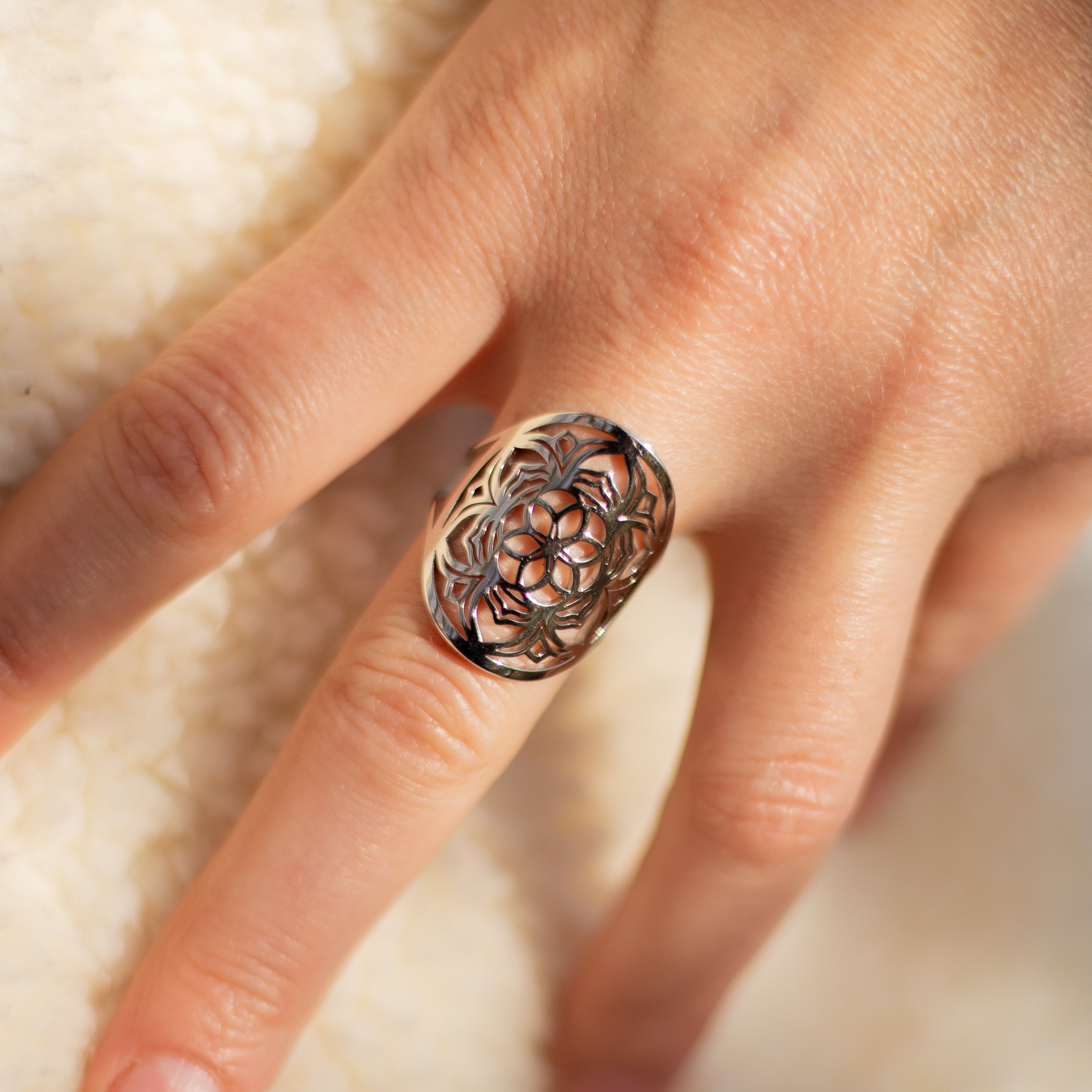 Styled shot of the adjustable ring on a finger - KARMAKIND