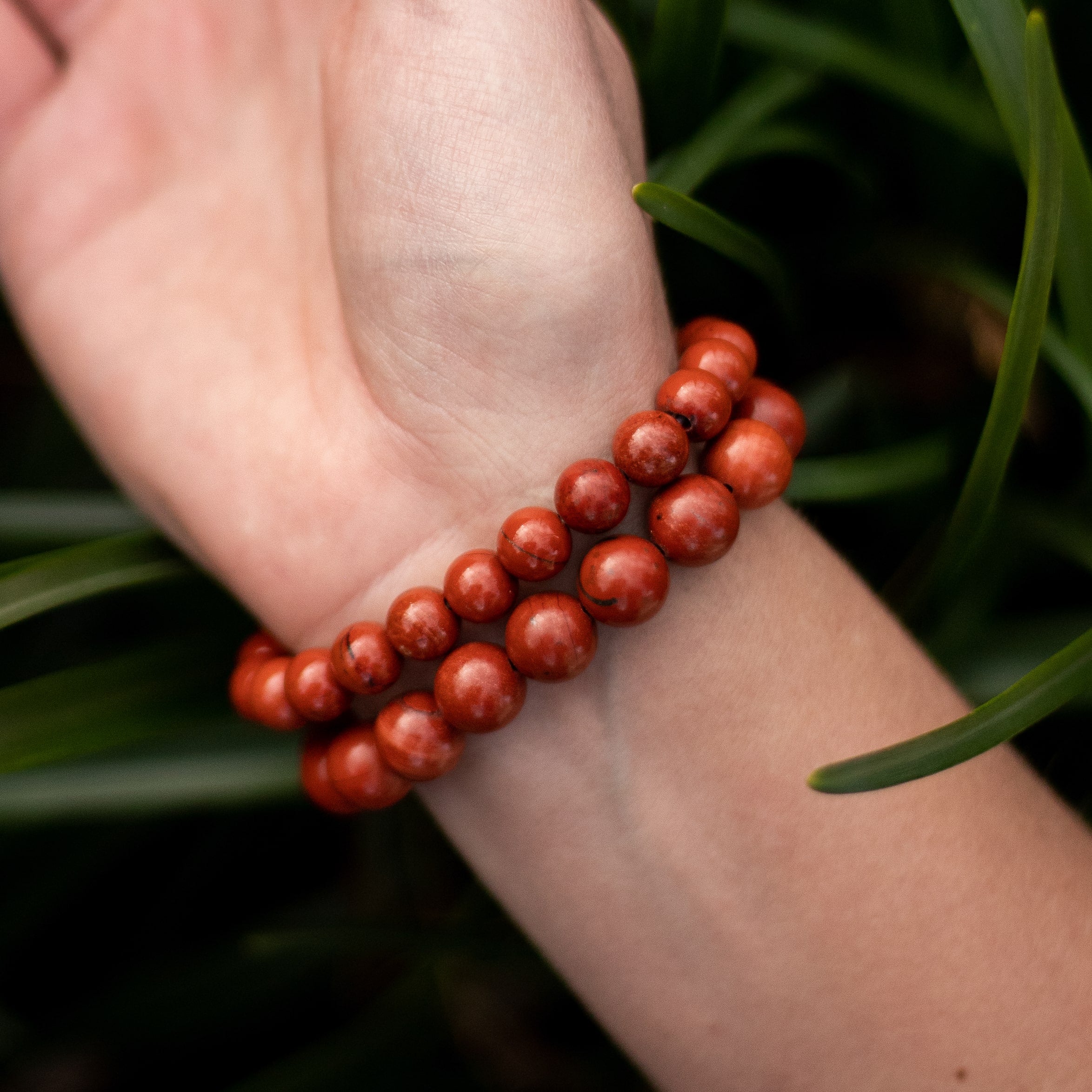 Close-up of the rich, earthy Red Jasper stones - KARMAKIND