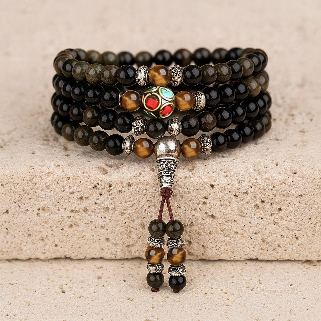 Black and golden obsidian mala bracelet with silver details and amber beads