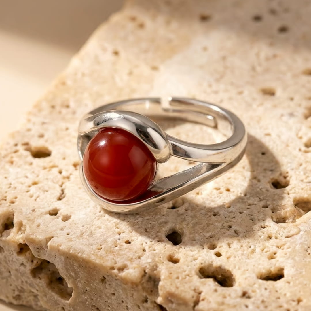 Lifestyle shot of the Red Agate Ring on a finger - KARMAKIND