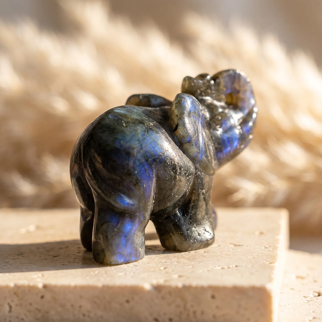 The Labradorite elephant figurine in a decorative setting - KARMAKIND