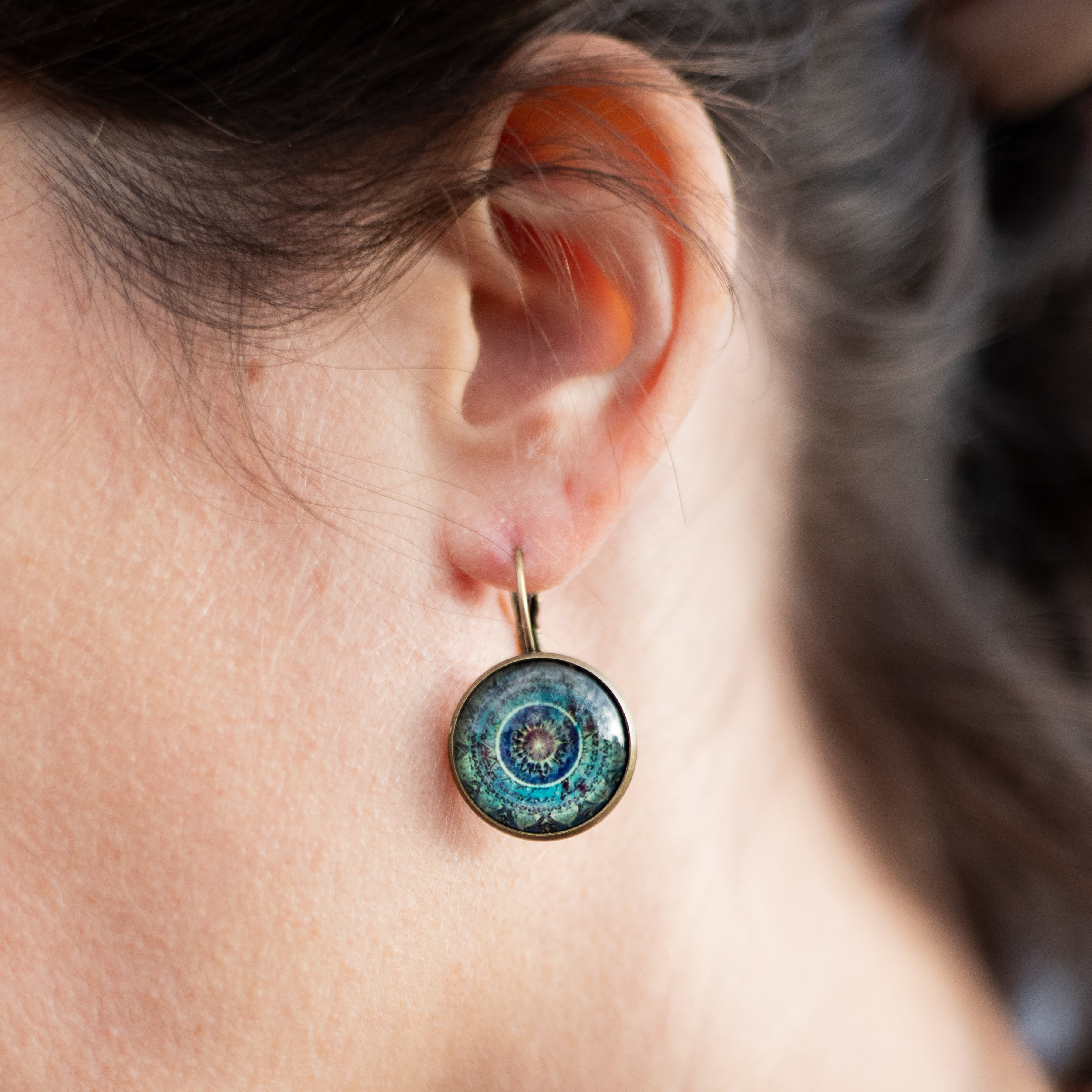 Close-up of the intricate mandala design on the earrings - KARMAKIND