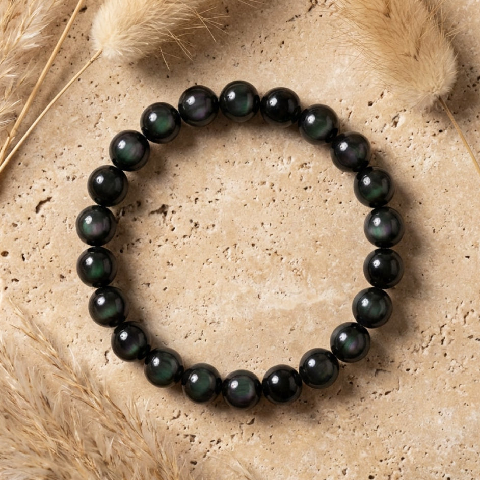 The bracelet displayed on a wrist, showing its protective aura - KARMAKIND