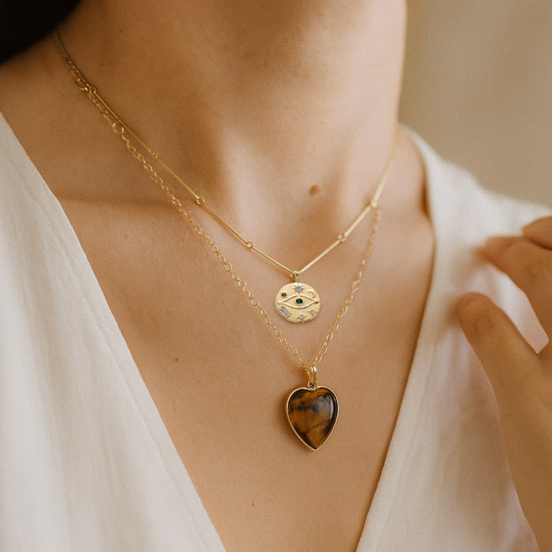 Close-up of tiger's eye heart pendant on double layer necklace - KARMAKIND