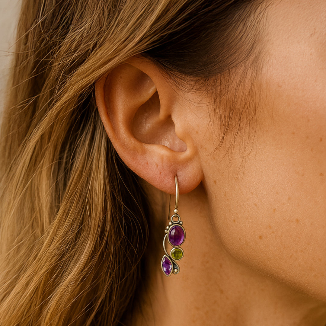 Close-up of amethyst and peridot stones in earrings - KARMAKIND
