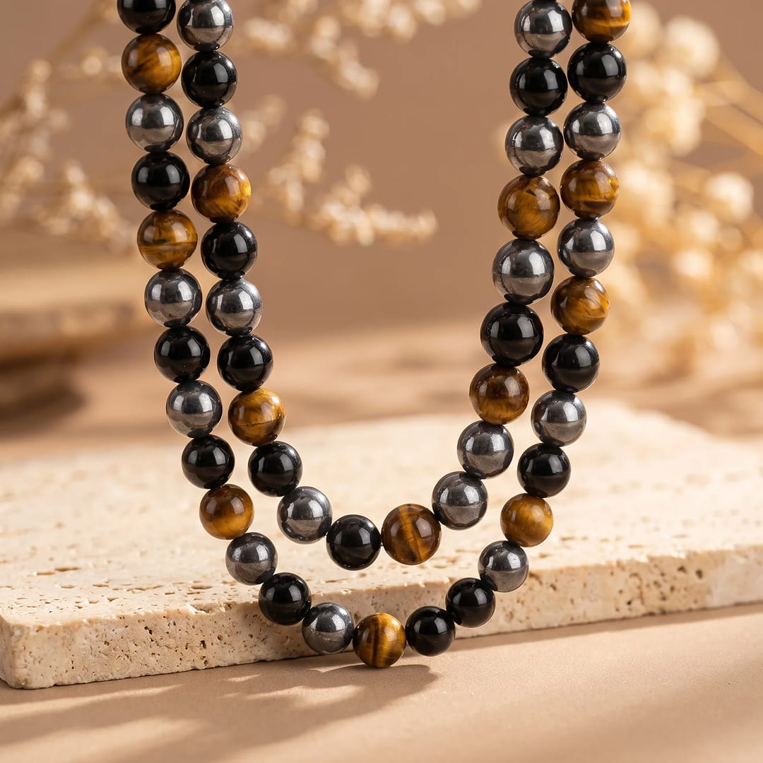 Close-up of Obsidian gemstone bead on the necklace - KARMAKIND