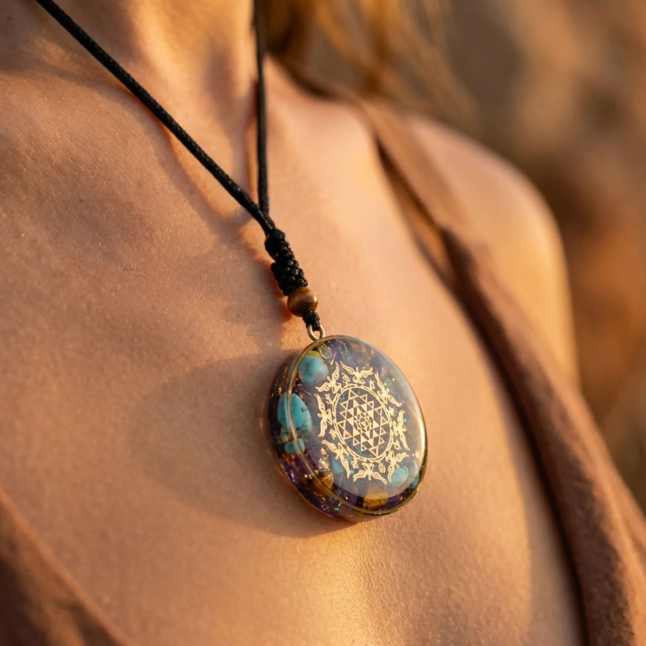 Close-up of the Sri Yantra symbol on the orgonite pendant - KARMAKIND