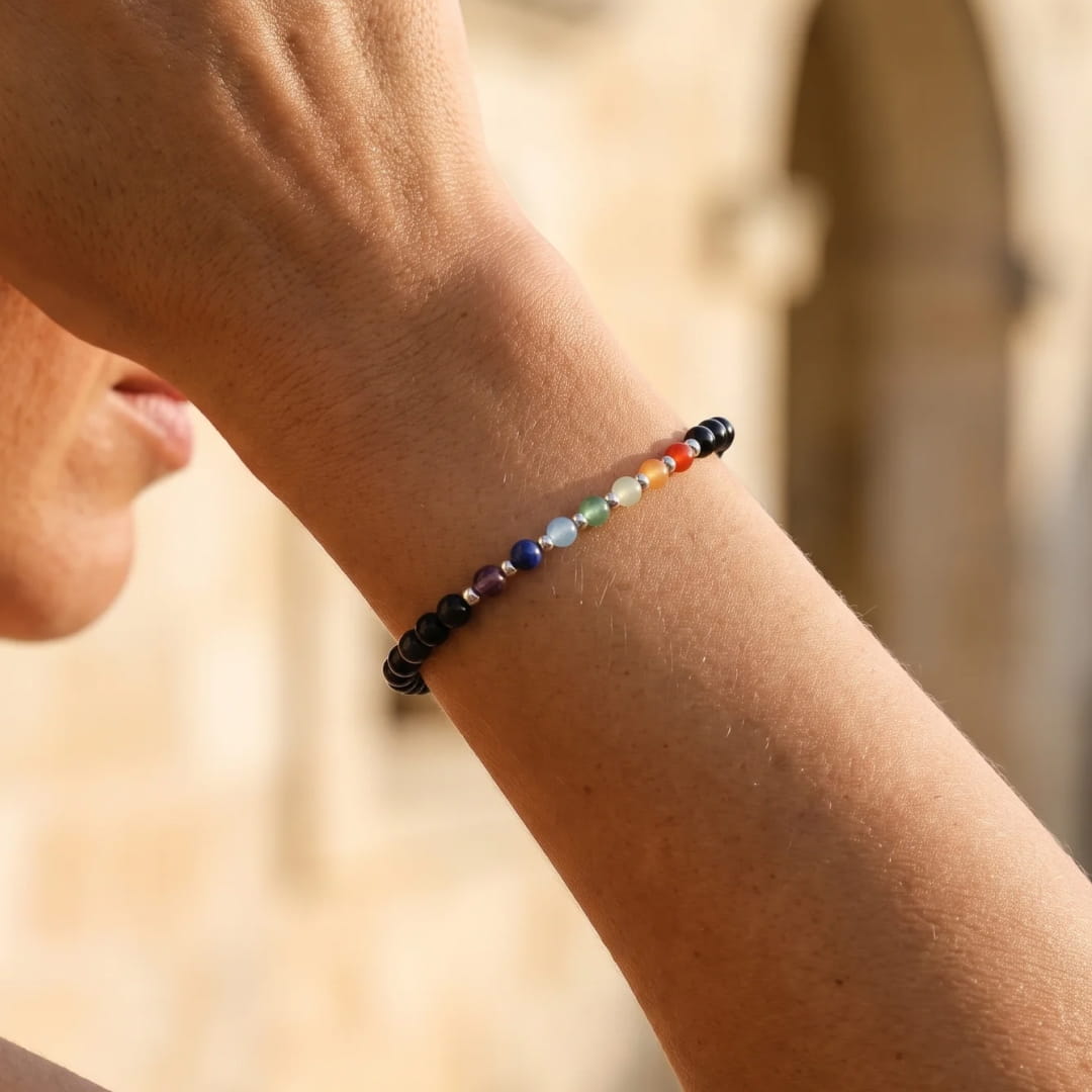 Close-up of the 7 chakra stones on the thin bracelet