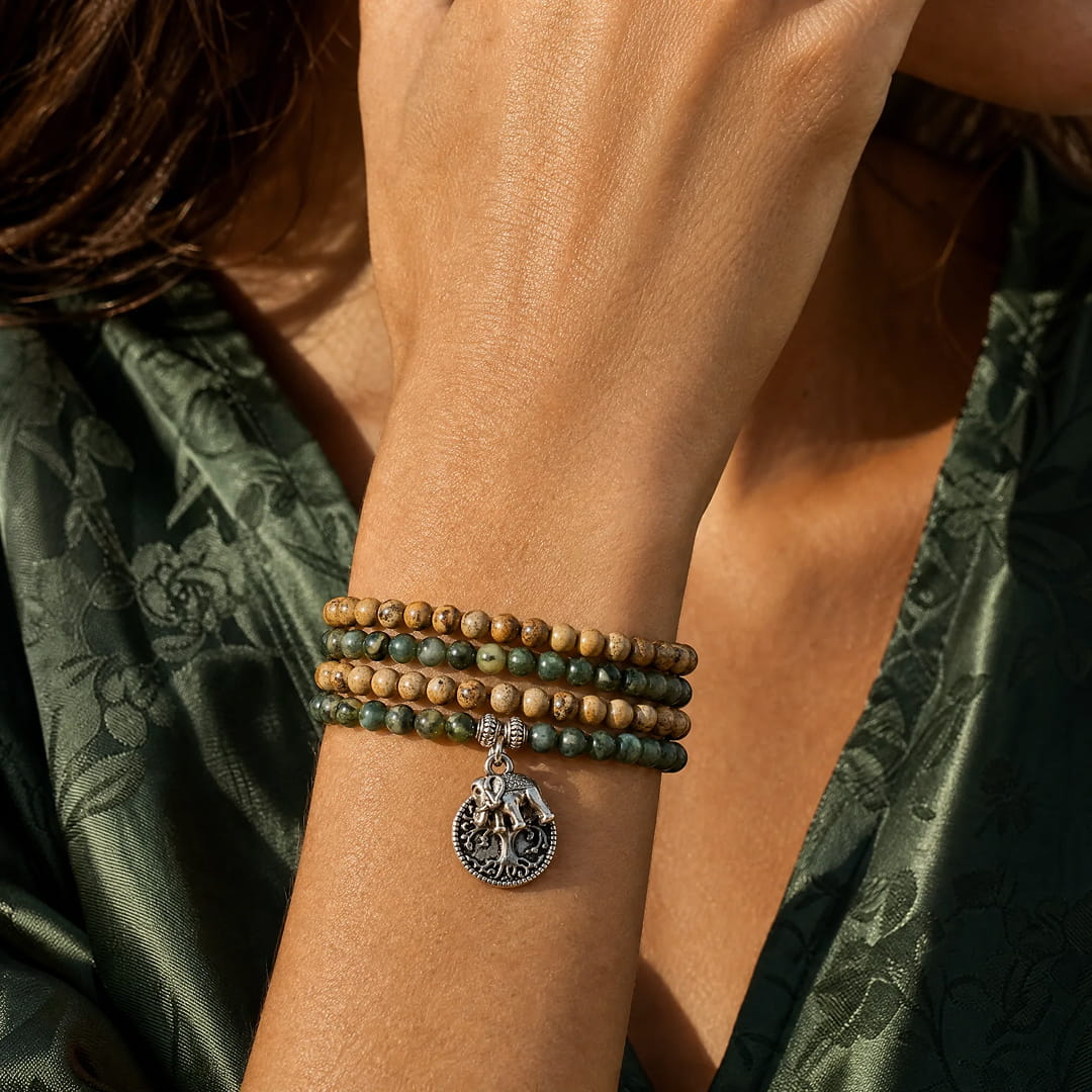 Close-up of moss agate beads on a mala bracelet