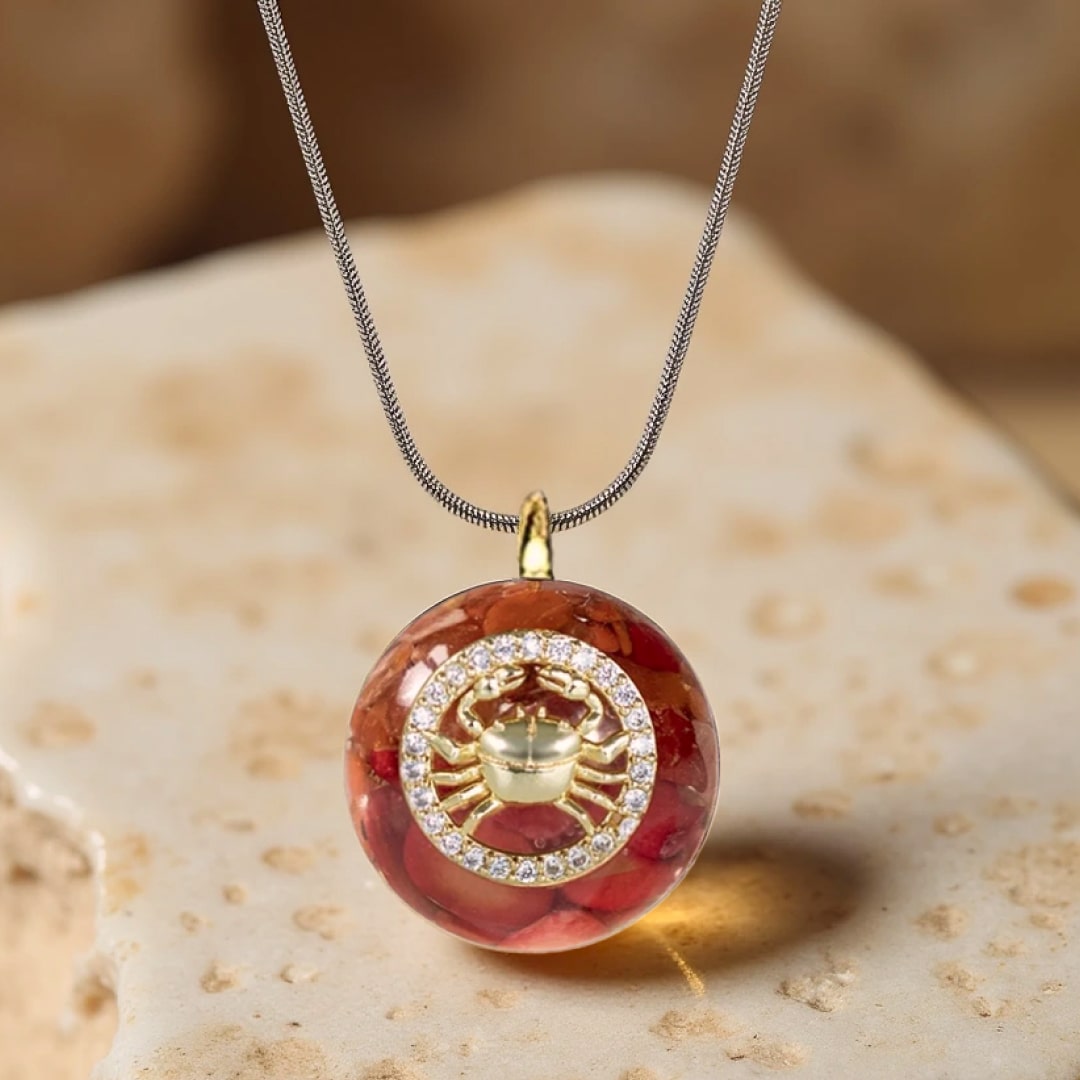 Close-up of golden zodiac symbol within the pendant