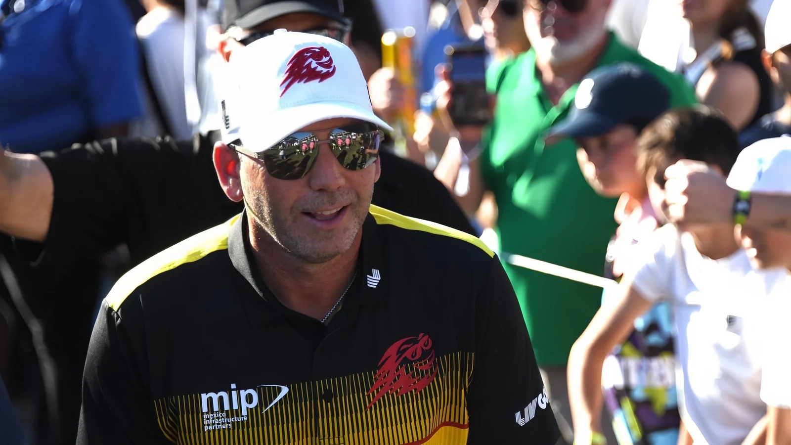 Sergio Garcia wearing USWING sunglasses at a professional golf event