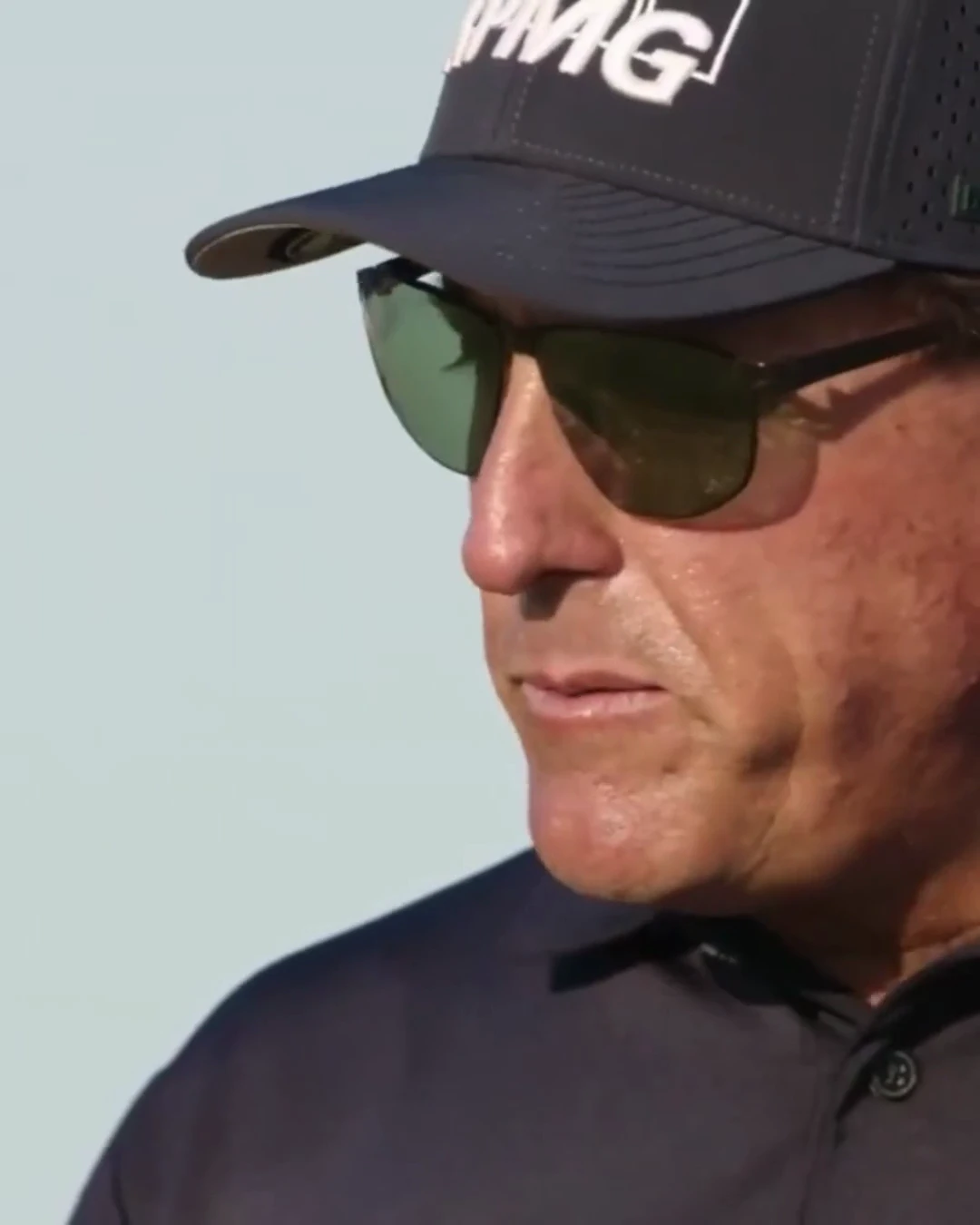 Frame from USWING course video — golfer wearing sunglasses