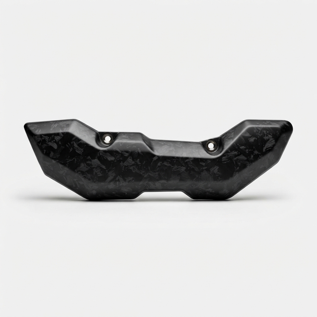 Black carbon fiber motorcycle exhaust heat shield on matte off-white background