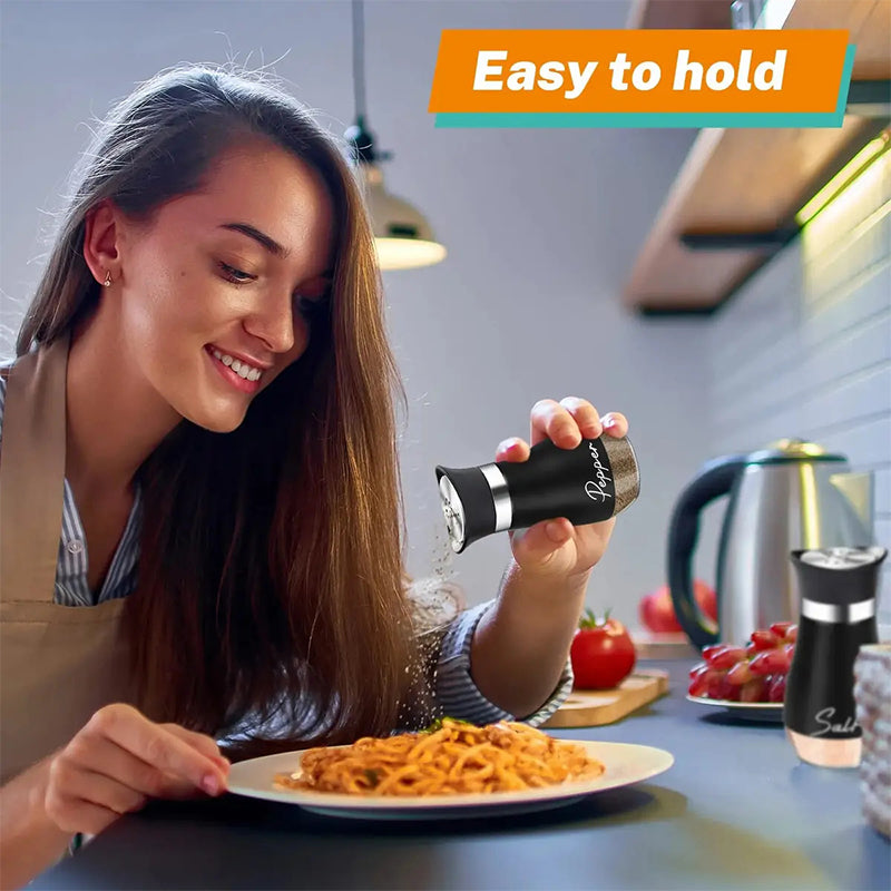 Easy to hold curved pepper shaker used while seasoning food