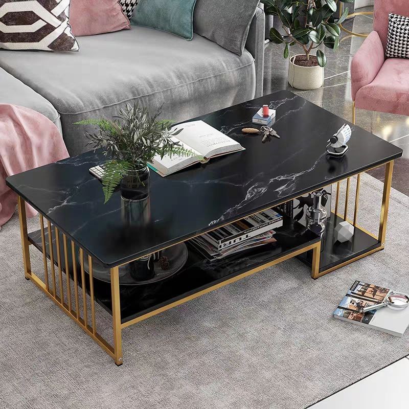 Bold black coffee table with gold accents and marble veins