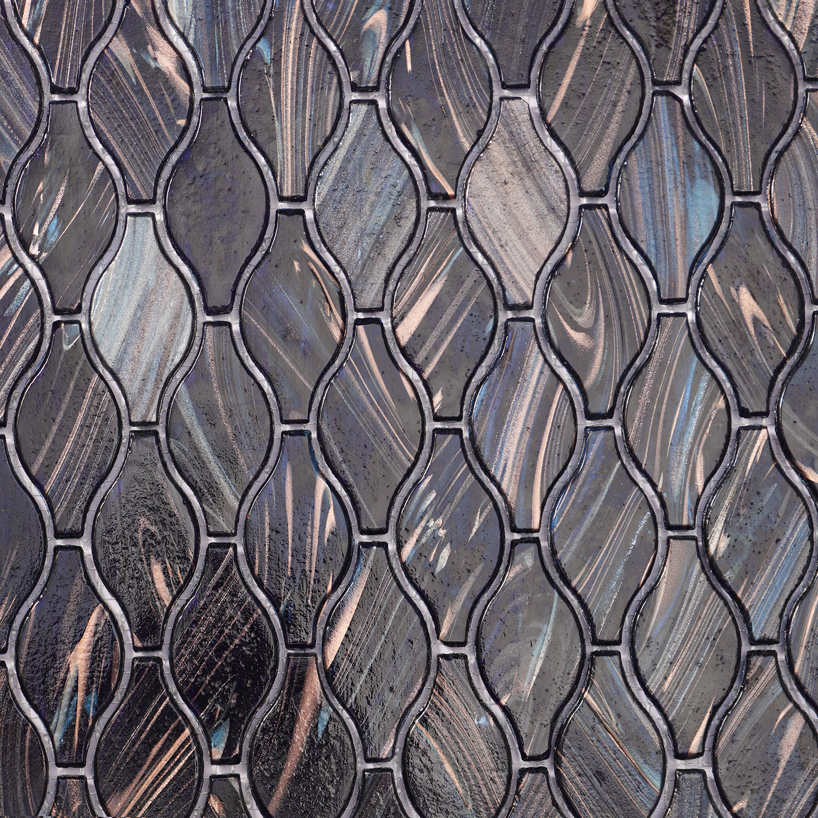 Close-up of dark blue arabesque mosaic tiles with intricate patterns.