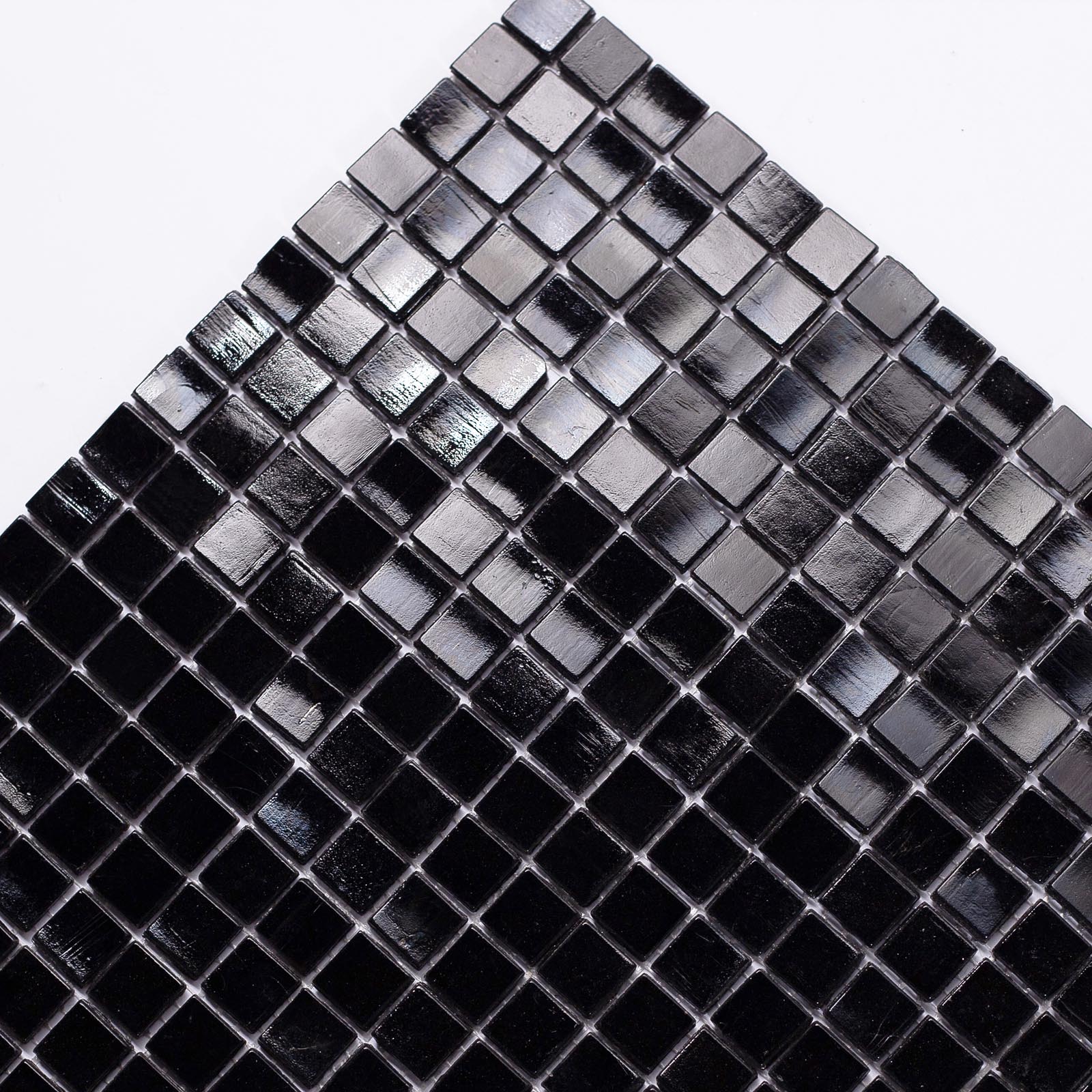 Detailed close-up of 15mm black glass mosaic tiles.
