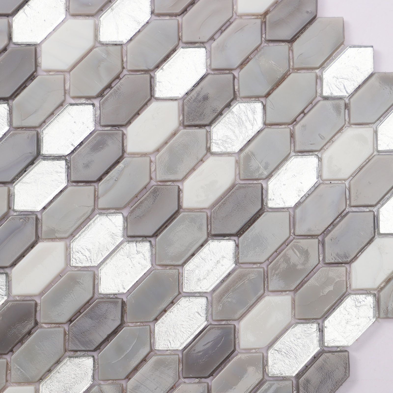Detailed close-up of micro picker grey mosaic tiles mixed.