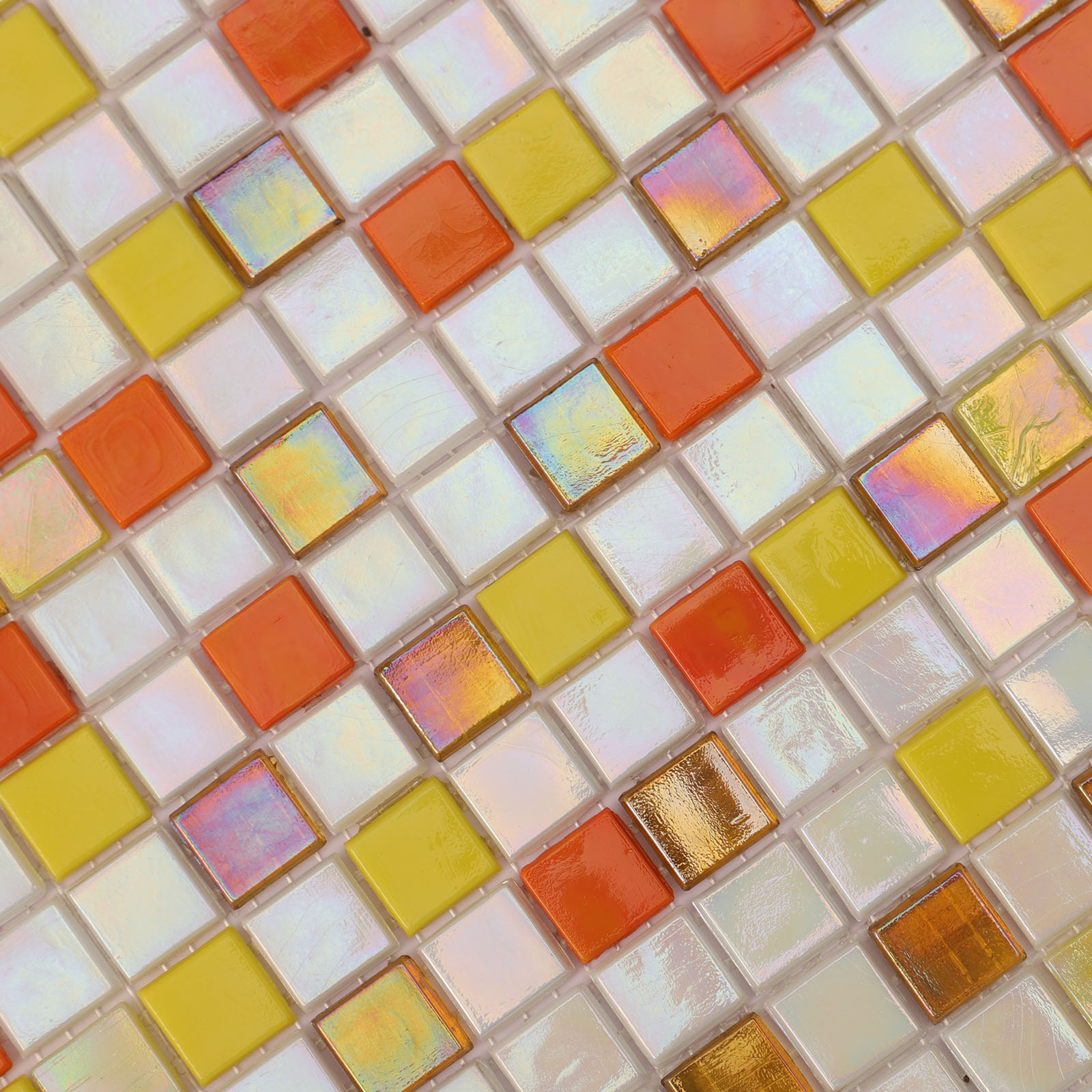 Close-up of red, orange, yellow, and blue glass mosaic tiles