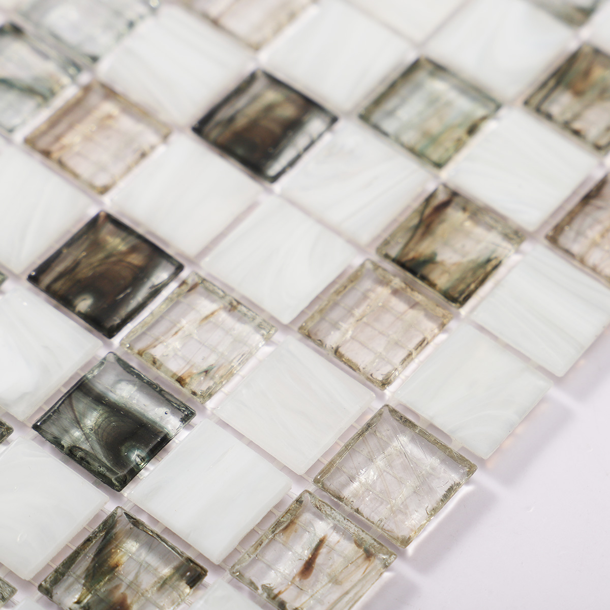 Close-up of amber translucence white and gray glass mosaic tile, view 2.