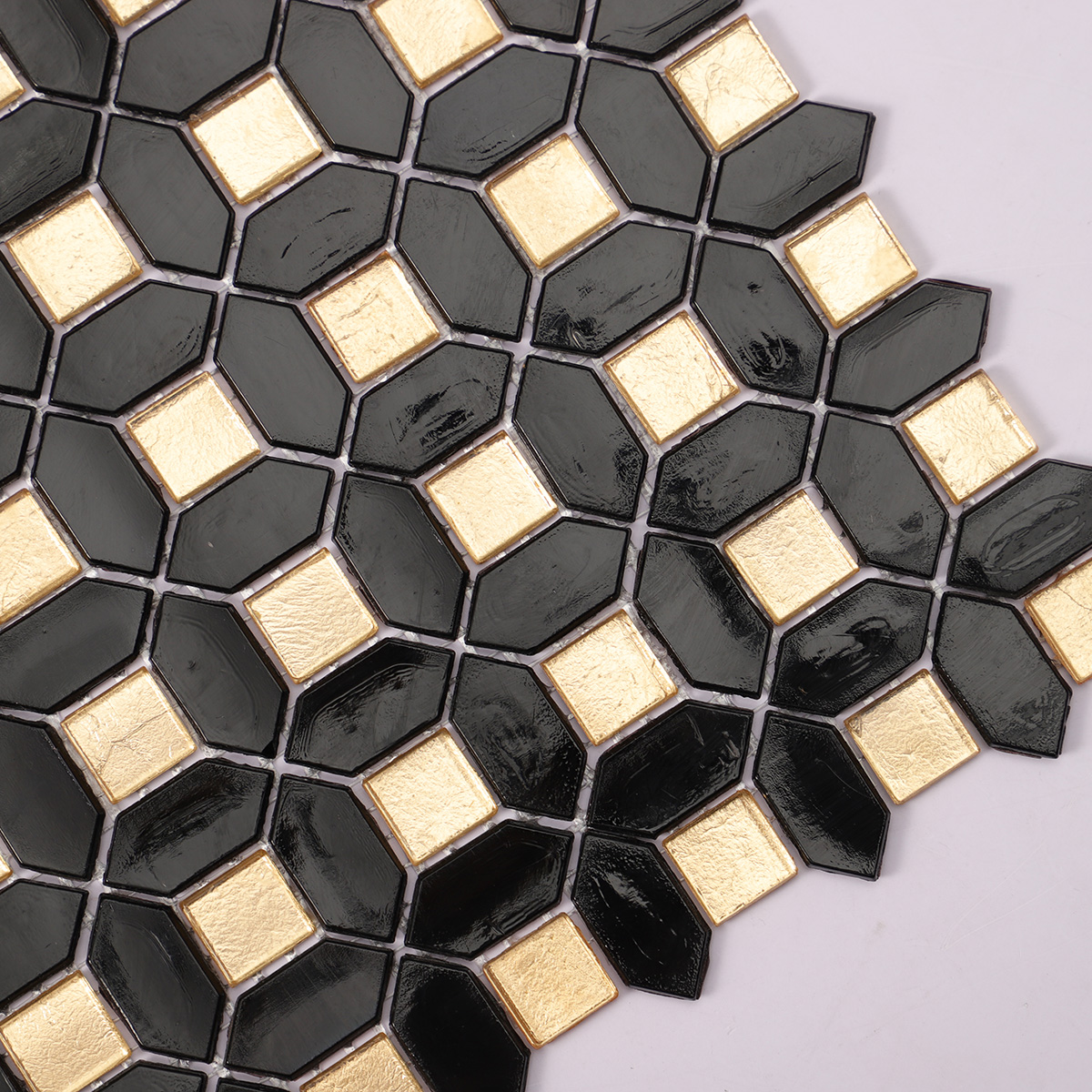 Detailed close-up of black mini picket and square gold glass mosaic 