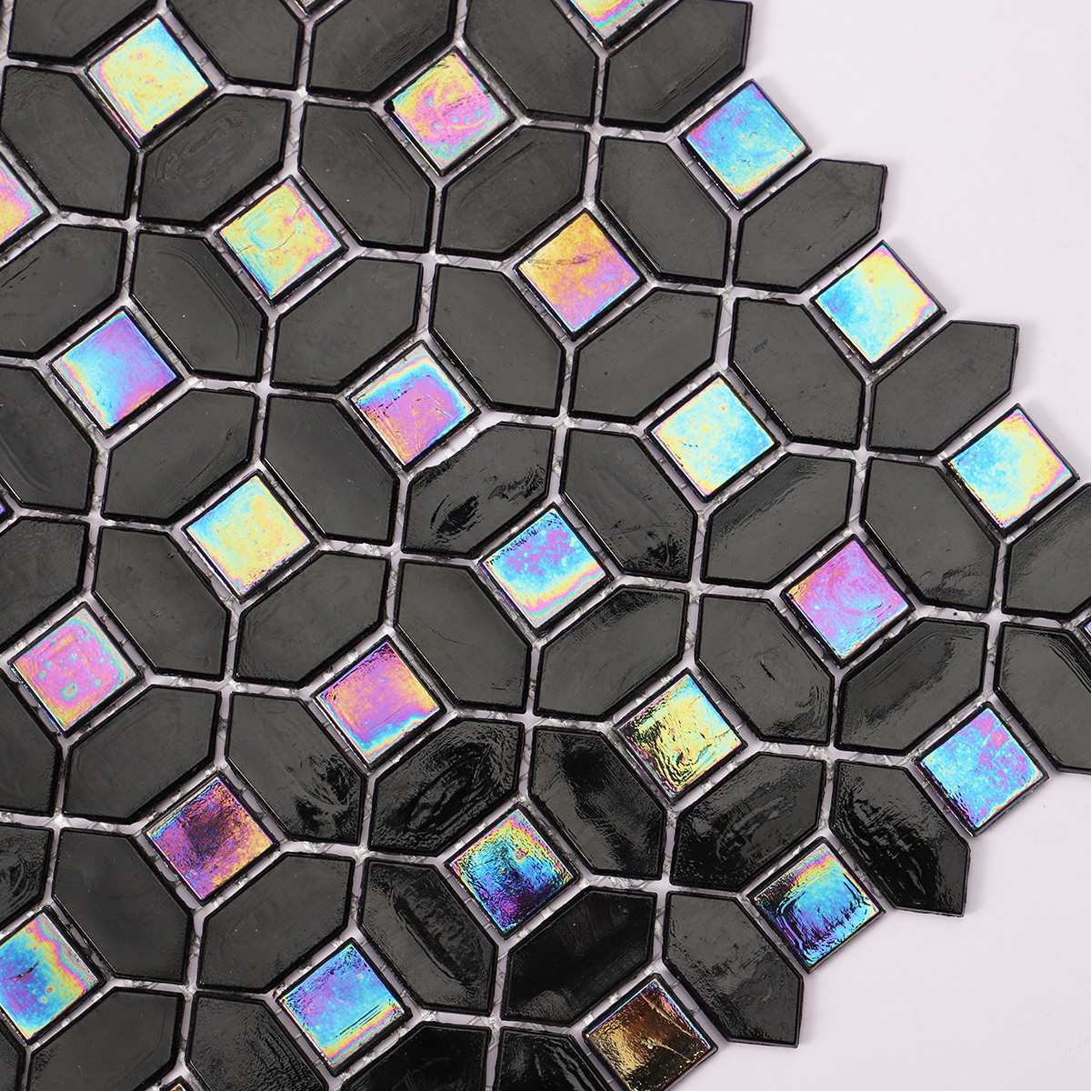 Close-up of black mini picket and square iridescent glass mosaic tiles.