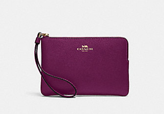 COACH F58035 CORNER ZIP WRISTLET IN SIGNATURE CANVAS BRIGHT VIOLET
